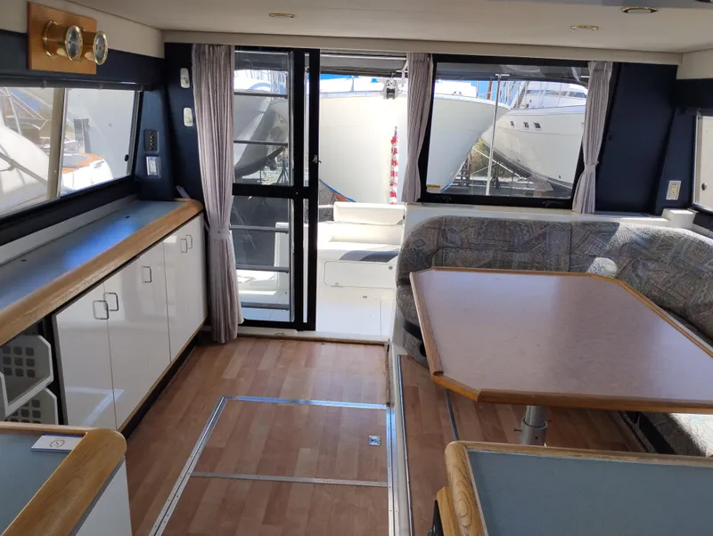 Slide: The Image of Interior of 1992 Bayliner 4388 Motoryacht with wood flooring and seating area. - 15