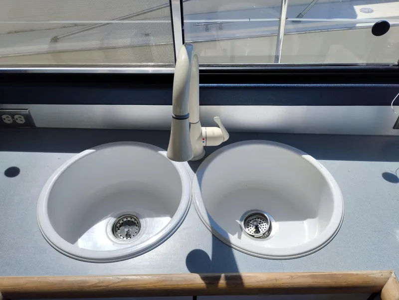 Slide: The Image of Dual sinks in the 1992 Bayliner 4388 Motoryacht kitchen area. - 19