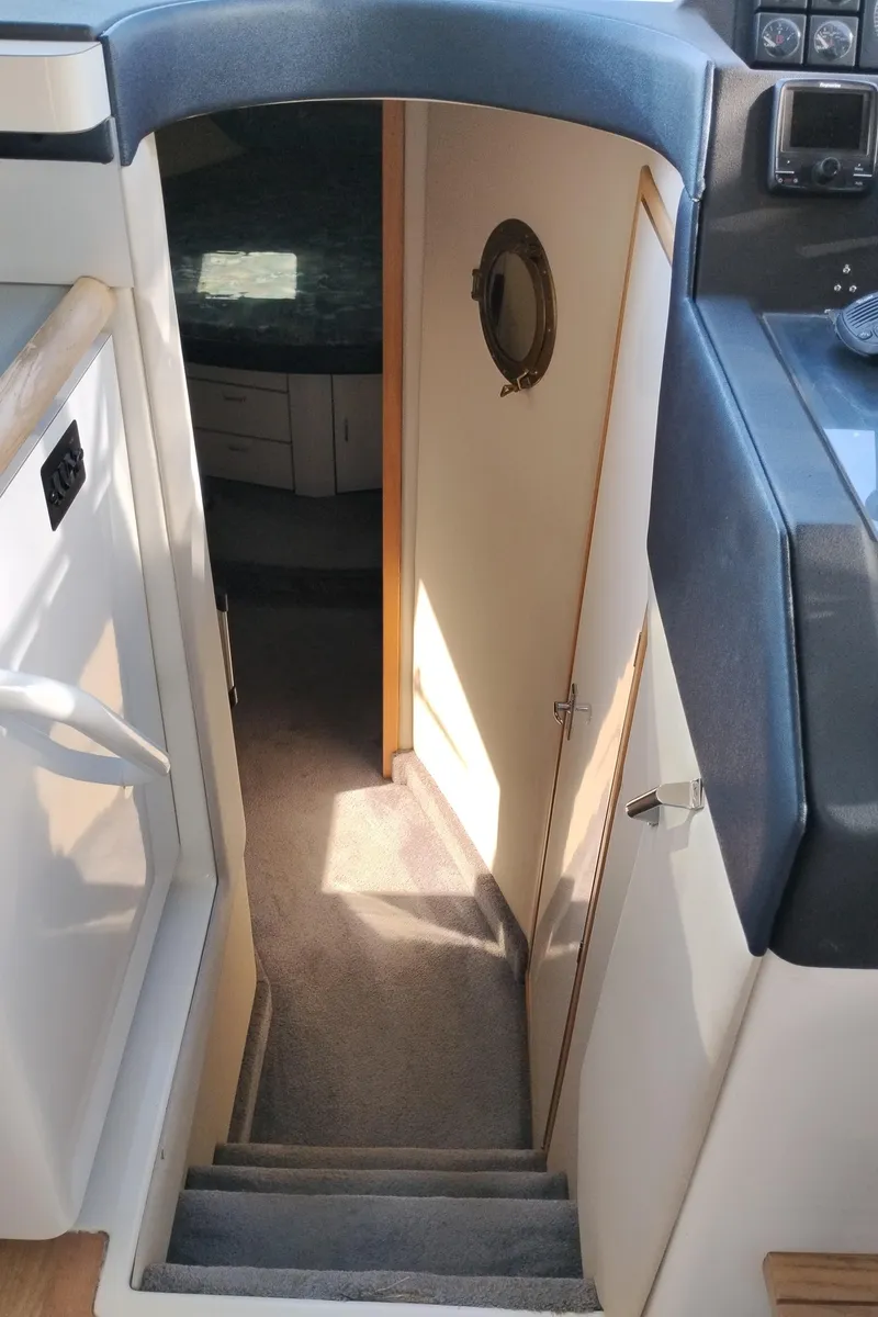 Slide: The Image of Stairway leading to cabin interior of 1992 Bayliner 4388 Motoryacht. - 27