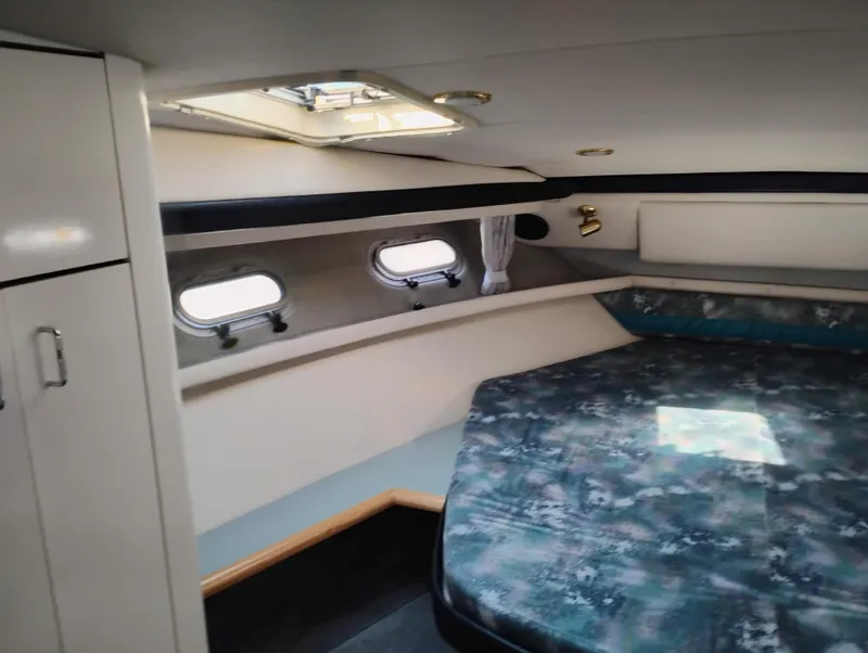 Slide: The Image of Interior cabin of 1992 Bayliner 4388 Motoryacht with bed and portholes. - 30