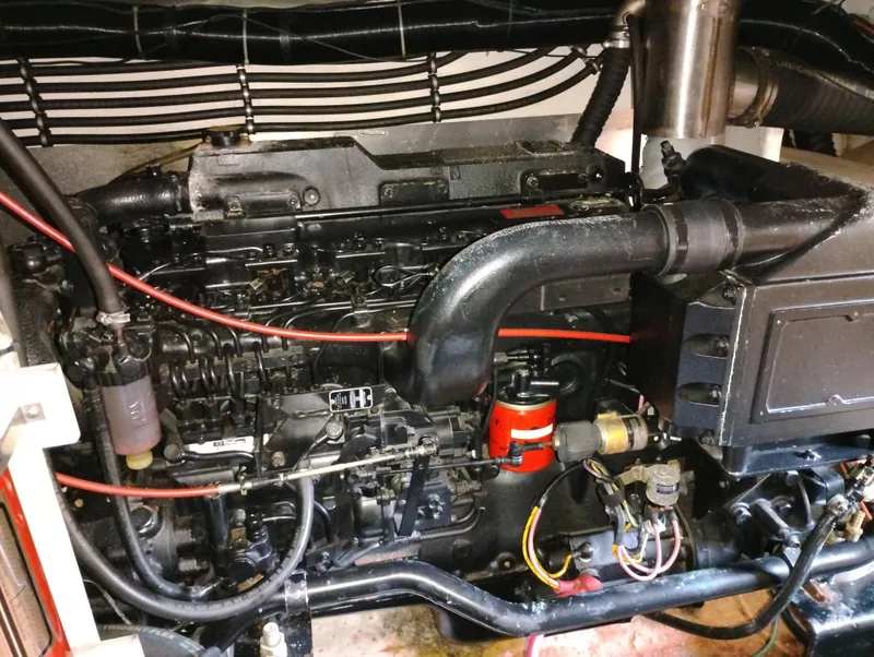 Slide: The Image of Engine of a 1992 Bayliner 4388 Motoryacht, showcasing intricate mechanical components. - 37