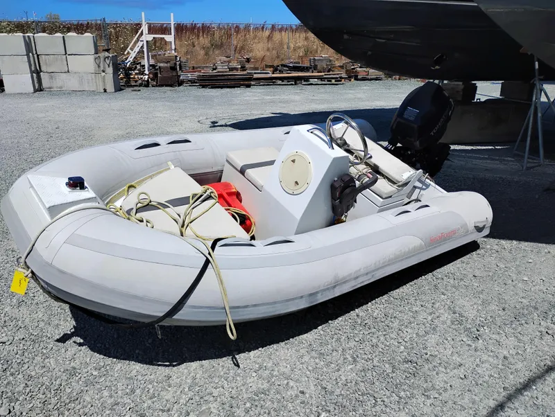 Slide: The Image of Inflatable dinghy beside a 1992 Bayliner 4388 Motoryacht on gravel lot. - 40