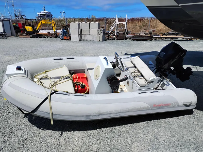 Slide: The Image of Inflatable boat with motor on gravel, near Bayliner 4388 Motoryacht, 1992 model. - 41
