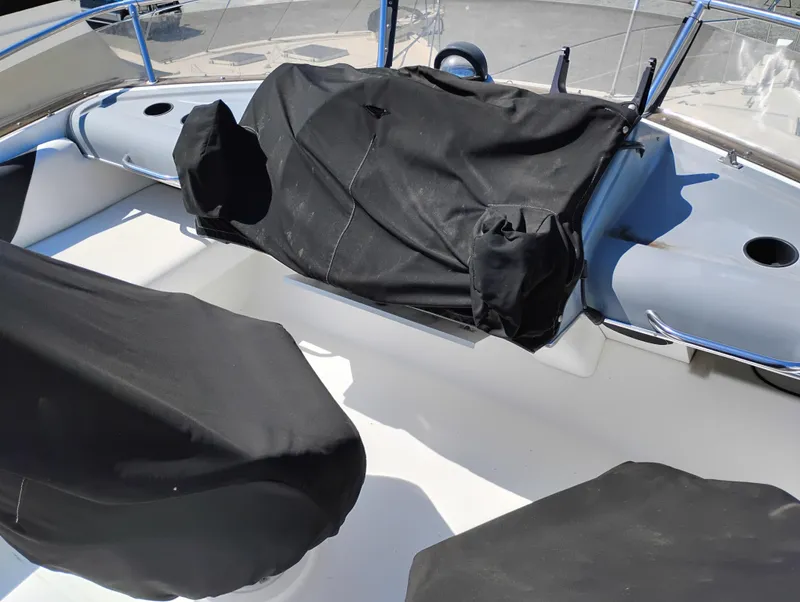 Slide: The Image of 1992 Bayliner 4388 Motoryacht cockpit with covered seating and controls. - 6