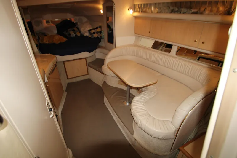 Slide: The Image of Interior of 2001 Sea Ray 340 Sundancer with seating area and bed. - 19