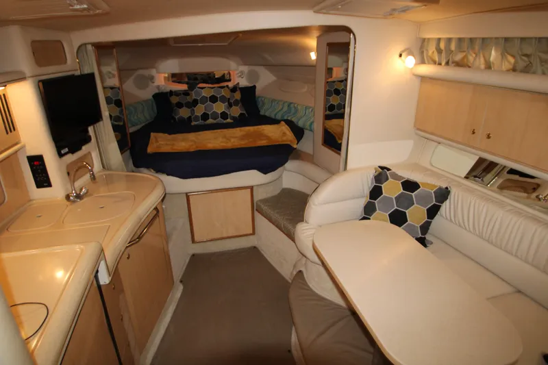 Slide: The Image of Interior of 2001 Sea Ray 340 Sundancer with kitchen and sleeping area. - 2