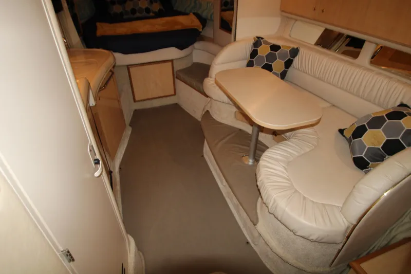 Slide: The Image of Interior of 2001 Sea Ray 340 Sundancer with seating area and table. - 22