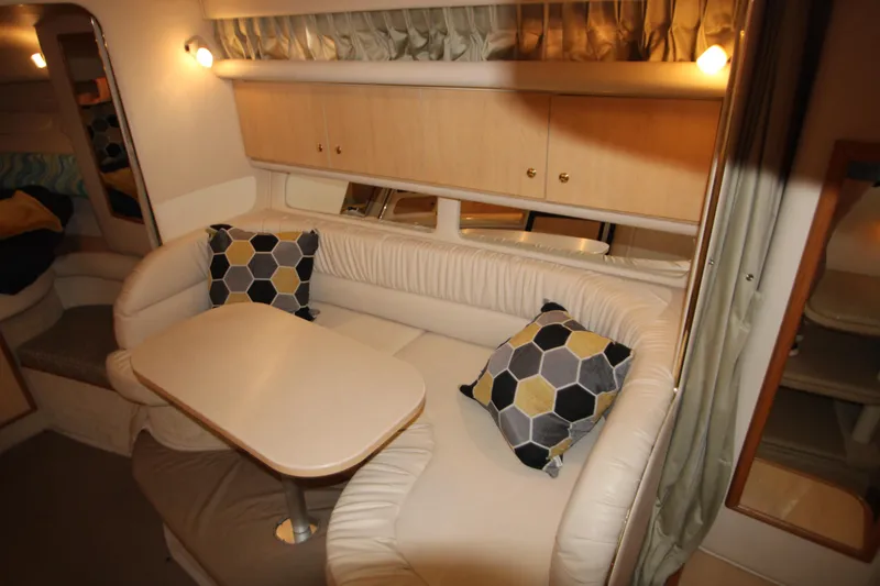 Slide: The Image of Interior of 2001 Sea Ray 340 Sundancer with cozy seating area. - 26
