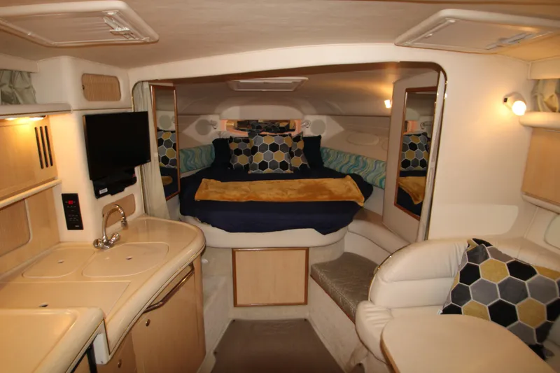 Slide: The Image of Interior of 2001 Sea Ray 340 Sundancer with bed and kitchenette. - 28