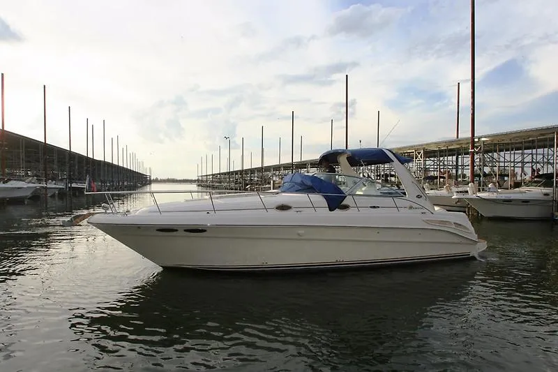 Slide: The Image of 2001 Sea Ray 340 Sundancer in harbor, calm water, cloudy sky. - 3