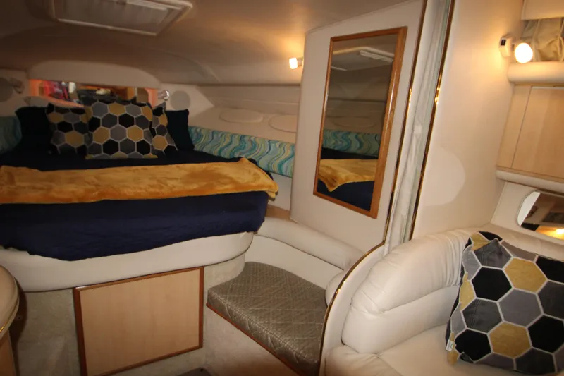 Slide: The Image of Interior of 2001 Sea Ray 340 Sundancer with cozy bed and pillows. - 32