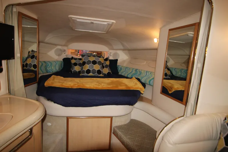 Slide: The Image of Interior of a 2001 Sea Ray 340 Sundancer yacht with cozy bed. - 33