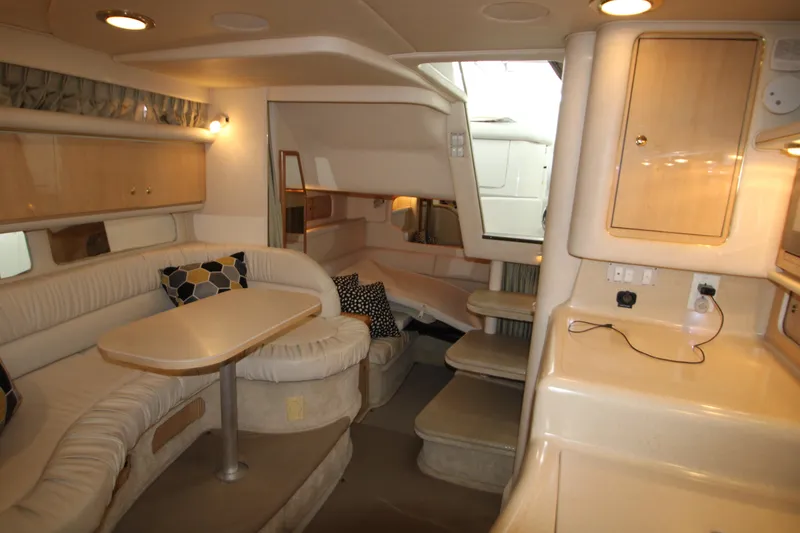 Slide: The Image of Interior of 2001 Sea Ray 340 Sundancer with cozy seating area. - 36