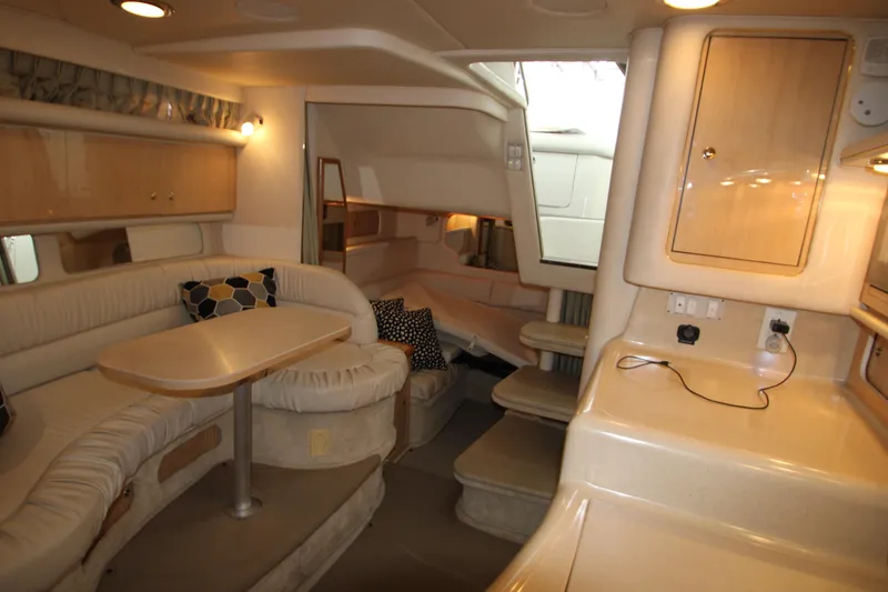 Slide: The Image of Interior of 2001 Sea Ray 340 Sundancer with seating area and table. - 37
