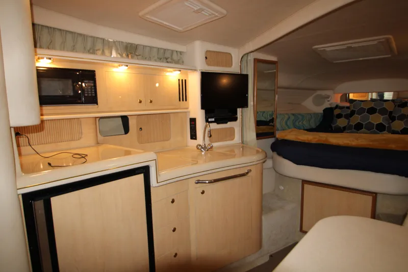Slide: The Image of Interior of 2001 Sea Ray 340 Sundancer with kitchen and sleeping area. - 43