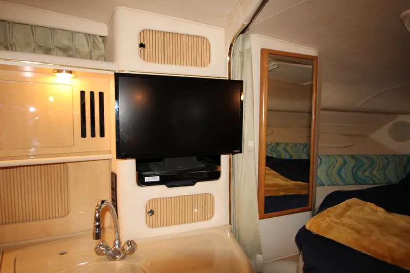 Slide: The Image of Interior of 2001 Sea Ray 340 Sundancer with TV and mirror. - 44