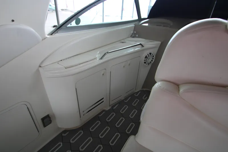 Slide: The Image of Interior of 2001 Sea Ray 340 Sundancer with seating and storage. - 9