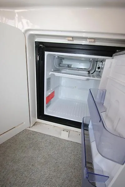 Slide: The Image of Open refrigerator inside 2001 Sea Ray 340 Sundancer boat cabin. - 36