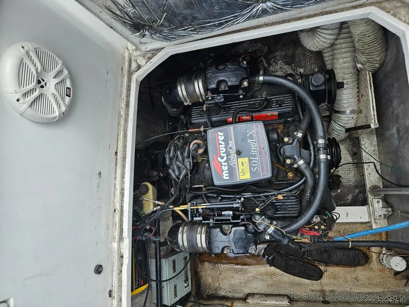 Slide: The Image of 1988 Trojan International boat engine compartment with MerCruiser Alpha One 5.0L engine. - 14