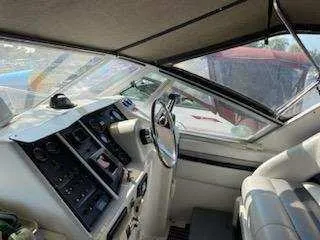 Slide: The Image of 1988 Trojan International boat interior with steering wheel and control panel. - 6