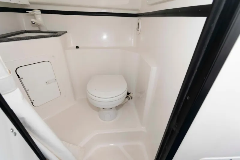 Slide: The Image of 1999 Fountain 47 Lightning boat bathroom with toilet and sink. - 24