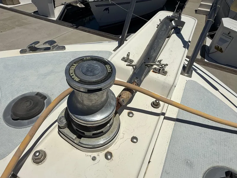 Slide: The Image of 1986 Kha Shing Nautique boat deck with Maxwell winch and railing. - 10