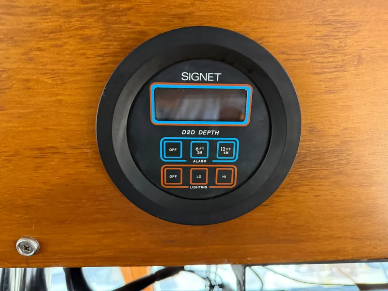Slide: The Image of Depth gauge on 1986 Kha Shing Nautique boat dashboard, featuring Signet D20 display. - 25