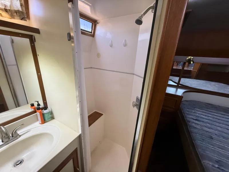 Slide: The Image of 1986 Kha Shing Nautique yacht interior with bathroom and bedroom view. - 27