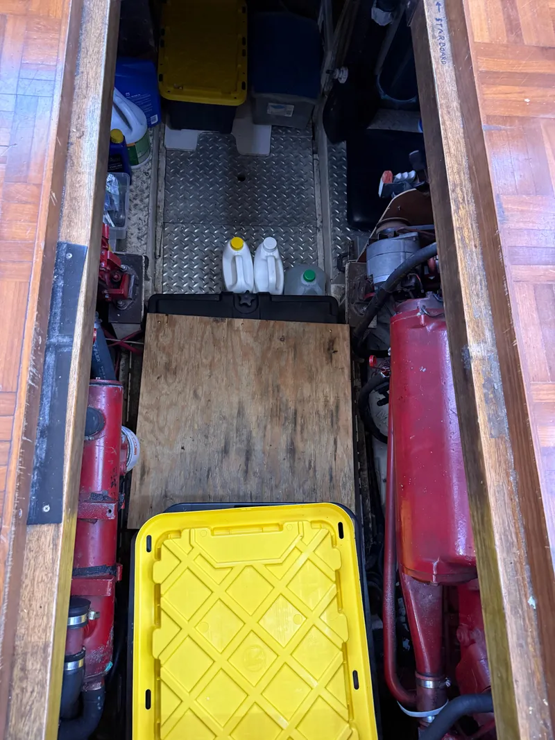 Slide: The Image of Engine room of 1986 Kha Shing Nautique with storage containers and equipment. - 31