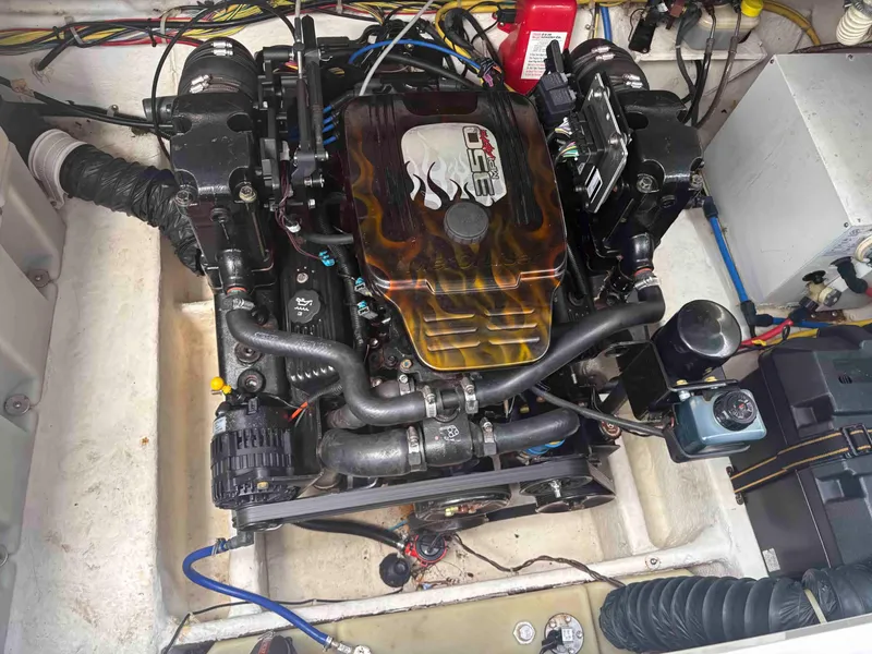 Slide: The Image of Engine compartment of a 2006 Bayliner 245 boat, featuring a MerCruiser 350 engine. - 6