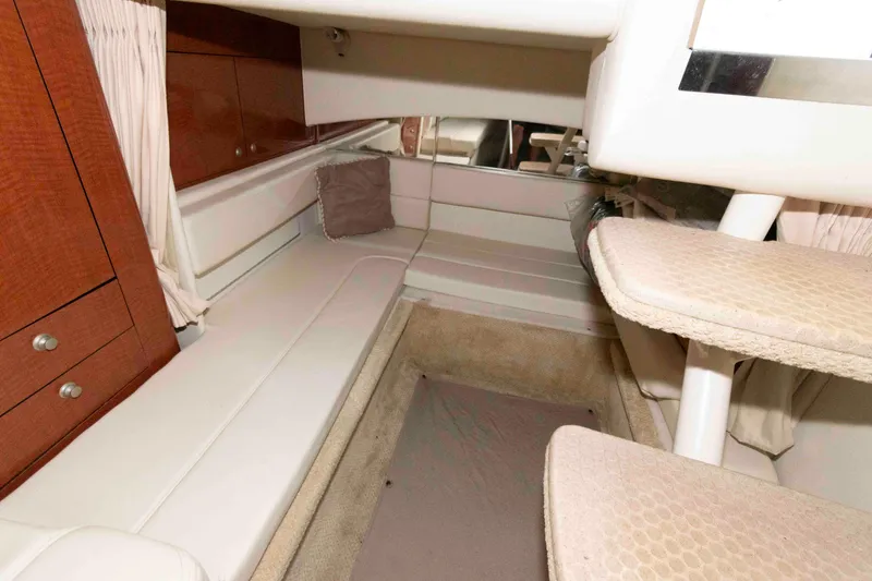 Slide: The Image of Interior cabin of 2005 Sea Ray 300 Sundancer with seating and storage. - 23