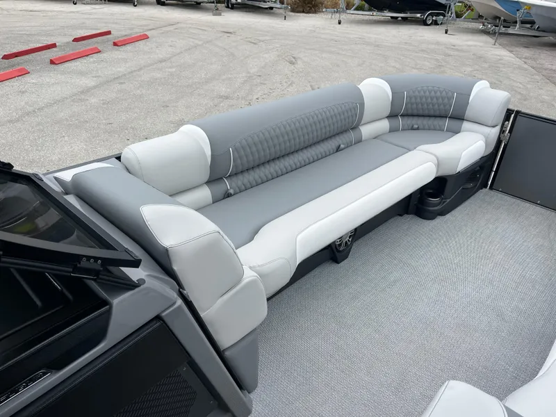 Slide: The Image of Luxurious seating on 2026 Avalon 2785 Excalibur LTD Windshield Quad Lounger boat. - 13