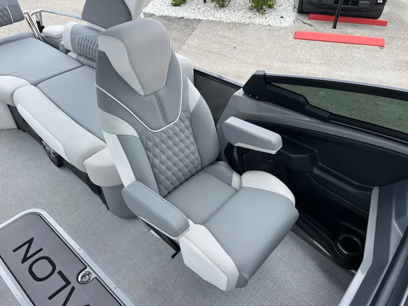 Slide: The Image of Luxurious seating in 2026 Avalon 2785 Excalibur LTD Windshield Quad Lounger boat, featuring modern design. - 17