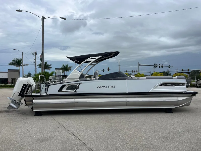 Slide: The Image of 2026 Avalon 2785 Excalibur LTD pontoon boat with Mercury 400hp V-10 engine, side view. - 4