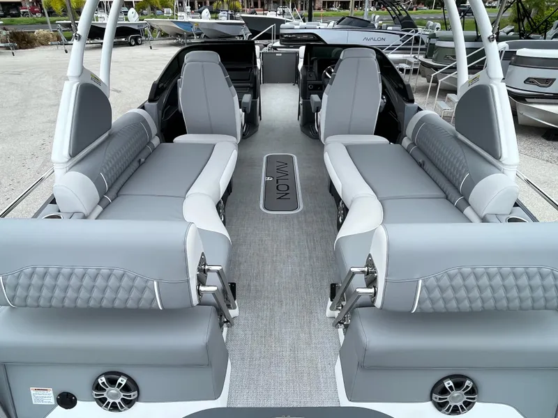 Slide: The Image of 2026 Avalon 2785 Excalibur LTD boat interior with quad loungers and modern design. - 8