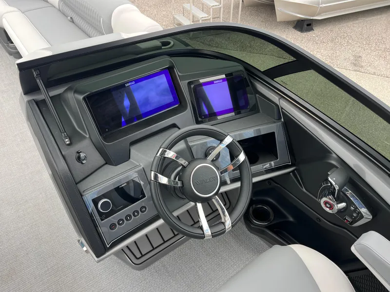 Slide: The Image of 2026 Avalon 2785 Excalibur LTD boat dashboard with advanced controls and dual displays. - 9
