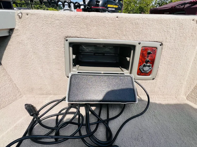 Slide: The Image of 2004 Tracker Targa WT boat dashboard with control panel and wiring. - 14