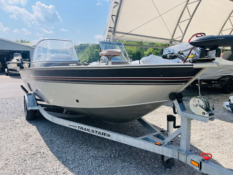 Slide: The Image of 2004 Tracker Targa WT boat on a Trailstar trailer under a canopy. - 15