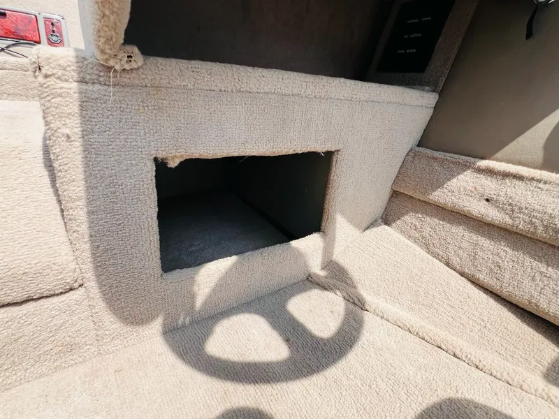 Slide: The Image of 2004 Tracker Targa WT interior with open carpeted compartment. - 21