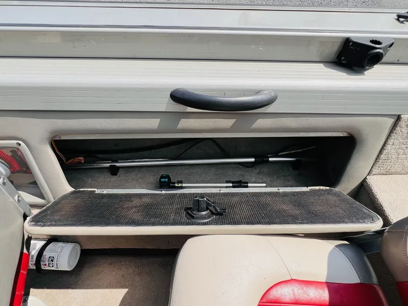 Slide: The Image of 2004 Tracker Targa WT boat interior storage compartment with handle and equipment. - 3