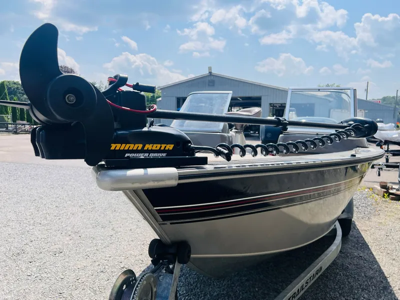 Slide: The Image of 2004 Tracker Targa WT boat with Minn Kota Power Drive motor on a trailer. - 4