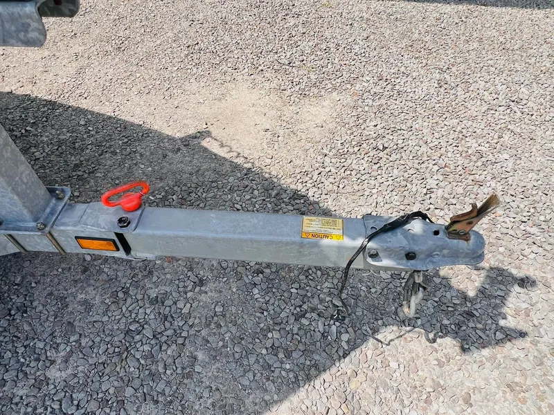 Slide: The Image of Trailer hitch of a 2004 Tracker Targa WT on gravel surface. - 7