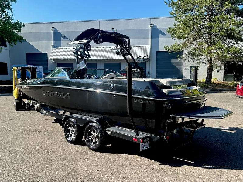 Slide: The Image of 2013 Supra SA350 boat on trailer in parking lot, side view. - 3