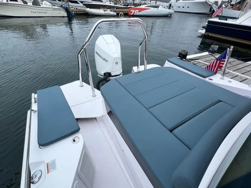 Slide: The Image of 2022 Axopar 28 Cabin Aft Cabin boat with Mercury engine, docked in marina. - 12