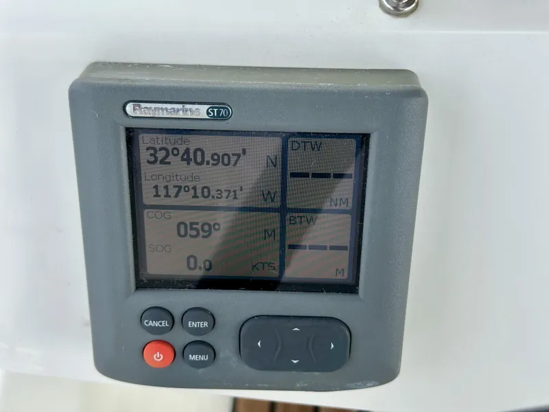 Slide: The Image of Raymarine ST70 display showing coordinates on a 2012 Beneteau Sense 43 yacht. - 12
