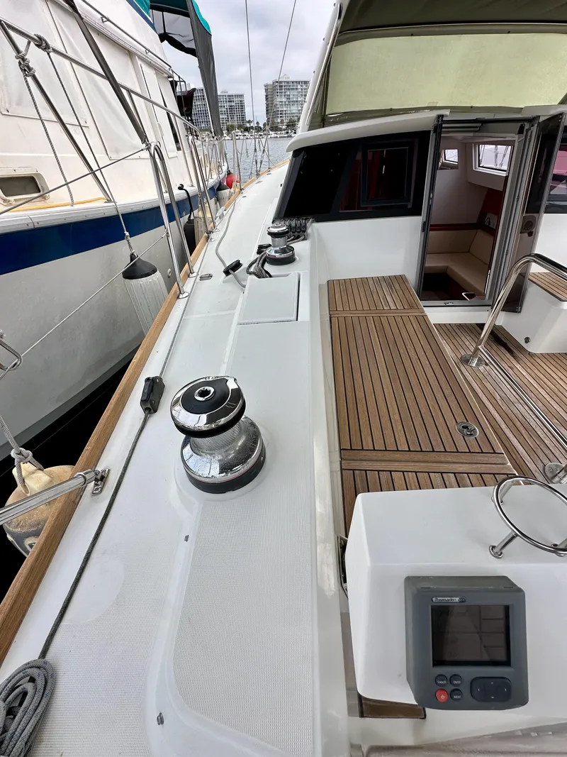 Slide: The Image of Beneteau Sense 43 yacht deck with winches and teak flooring, 2012 model. - 13