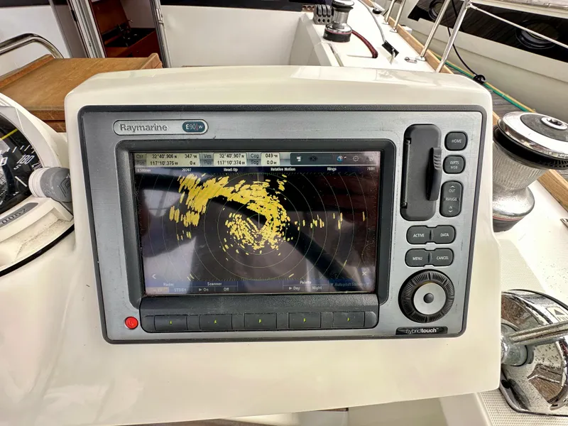 Slide: The Image of Raymarine E90W radar display on 2012 Beneteau Sense 43 yacht dashboard. - 17
