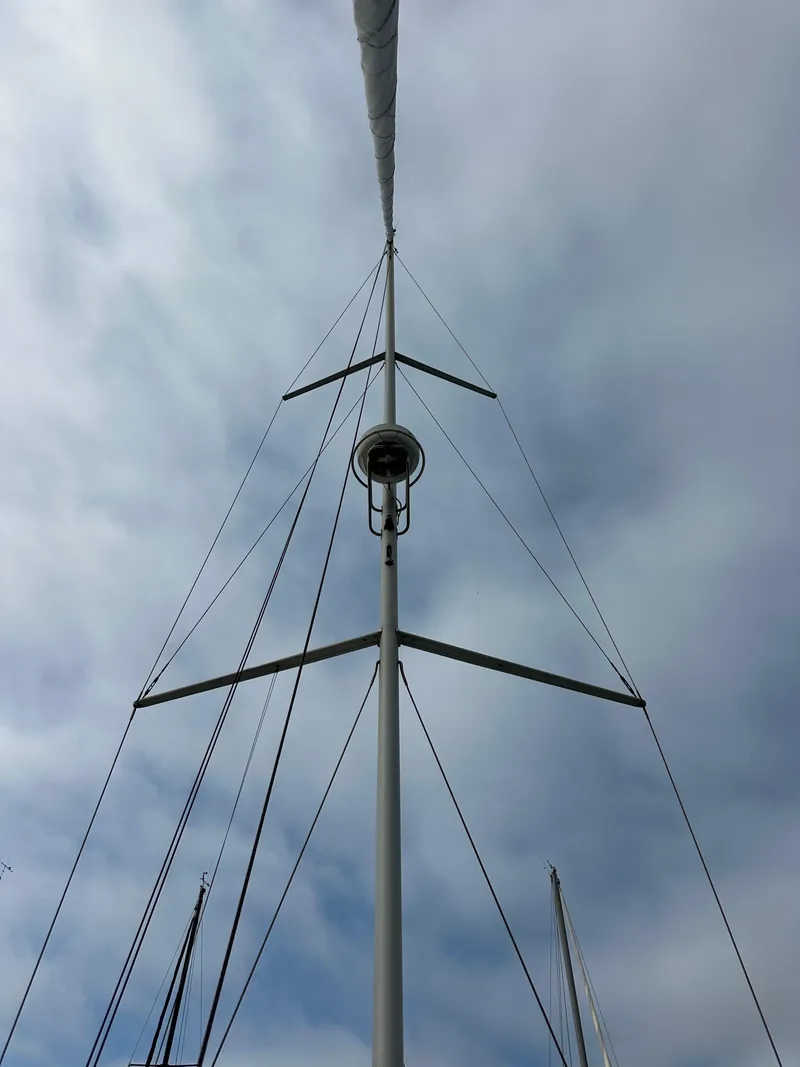 Slide: The Image of Mast of 2012 Beneteau Sense 43 sailboat against cloudy sky. - 26