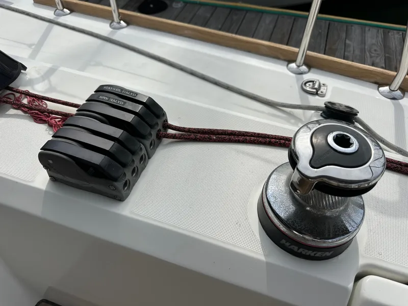 Slide: The Image of Deck of 2012 Beneteau Sense 43 sailboat with Harken winch and rope clutches. - 46