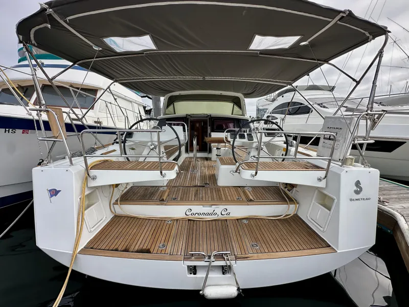 Slide: The Image of 2012 Beneteau Sense 43 yacht docked, featuring spacious deck and canopy in Coronado, CA. - 6